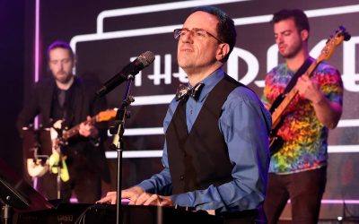 Producer and band leader Kenny Davidsen sings during a birthday party benefit for Las Vegas Rev ...