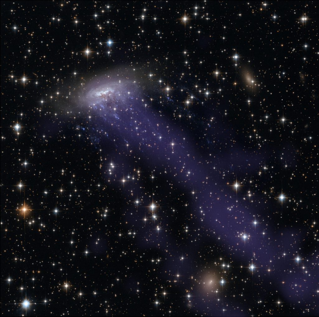 Oamenii de știință au descoperit cea mai îndepărtată galaxie cu tentacule observată până acum, cu ajutorul Telescopului Spațial James Webb (JWST)