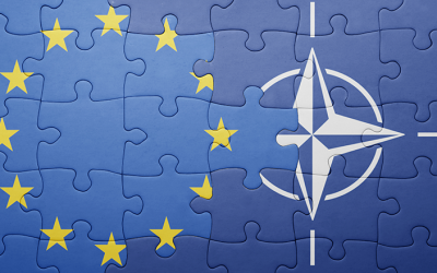 Bătălie UE-NATO: Cui îi revin influența și banii mari în România?