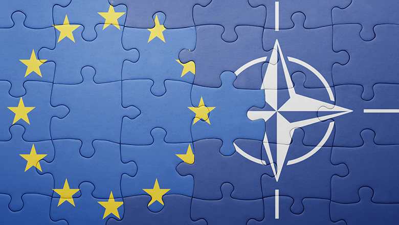 Bătălie UE-NATO: Cui îi revin influența și banii mari în România?