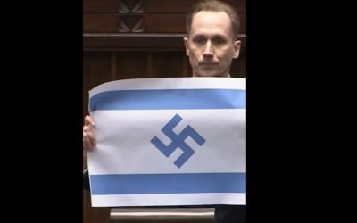 Deputat de extremă dreapta, cu steag israelian și svastică în Parlamentul Poloniei