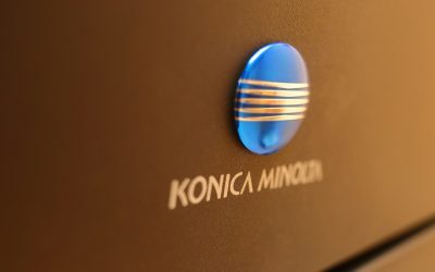 Konica Minolta, sub lupa Concurenței. Riscă amenzi uriașe